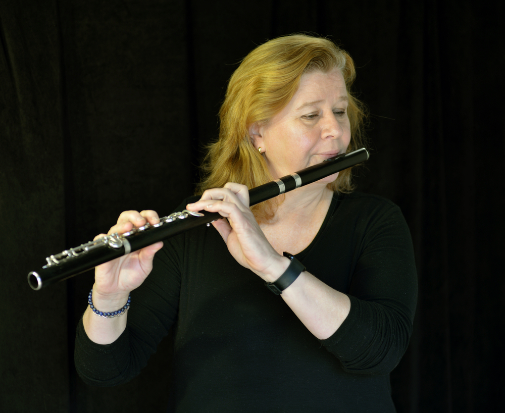 Emma Knott, playing her flute